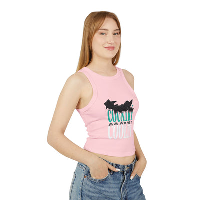 Woman wearing a pink micro rib racer tank top with a cool graphic design, showcasing a stylish look.