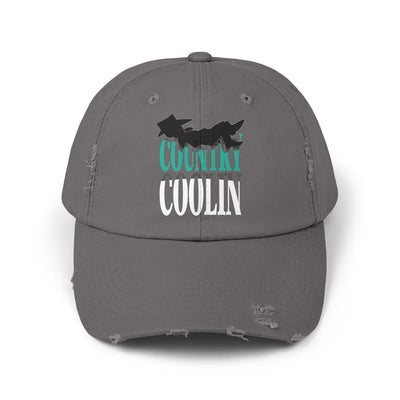 Unisex distressed cap in gray featuring a casual design and unique lettering for style and comfort.