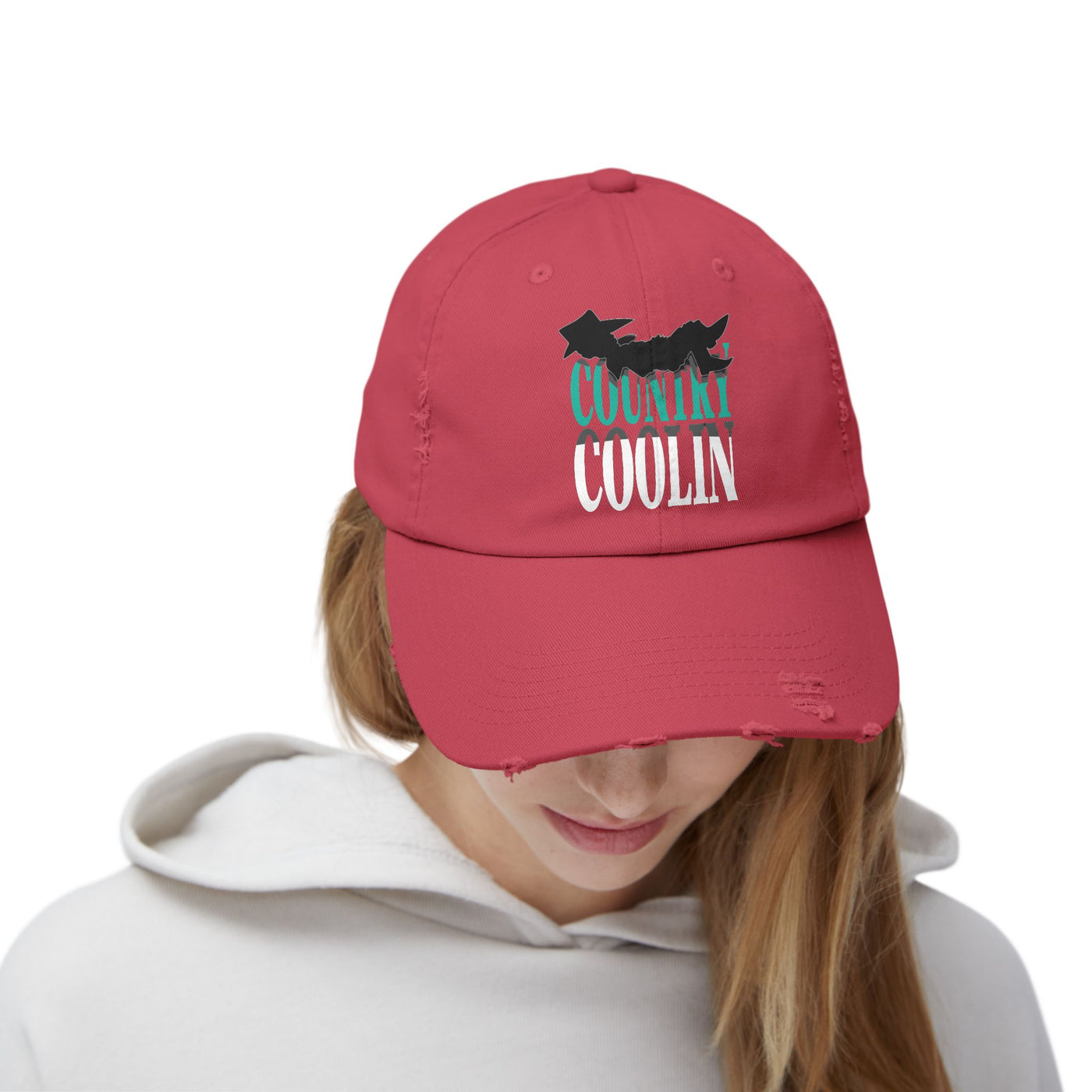 Unisex distressed cap in red with 'Country Coolin'' graphic, offering casual style and adjustable fit for everyday wear.