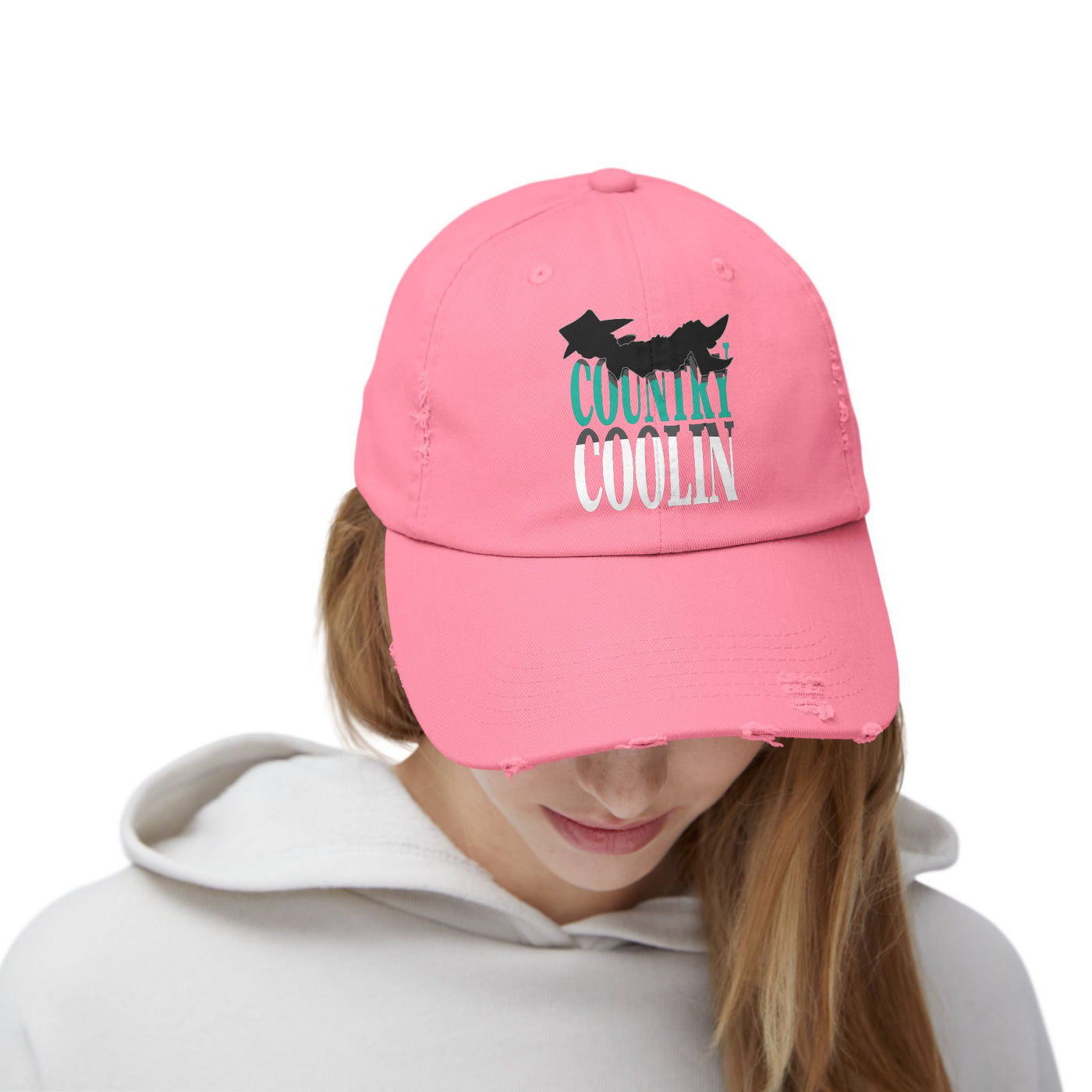 Unisex pink distressed cap featuring 'Country Coolin' text, perfect for casual style and sun protection.