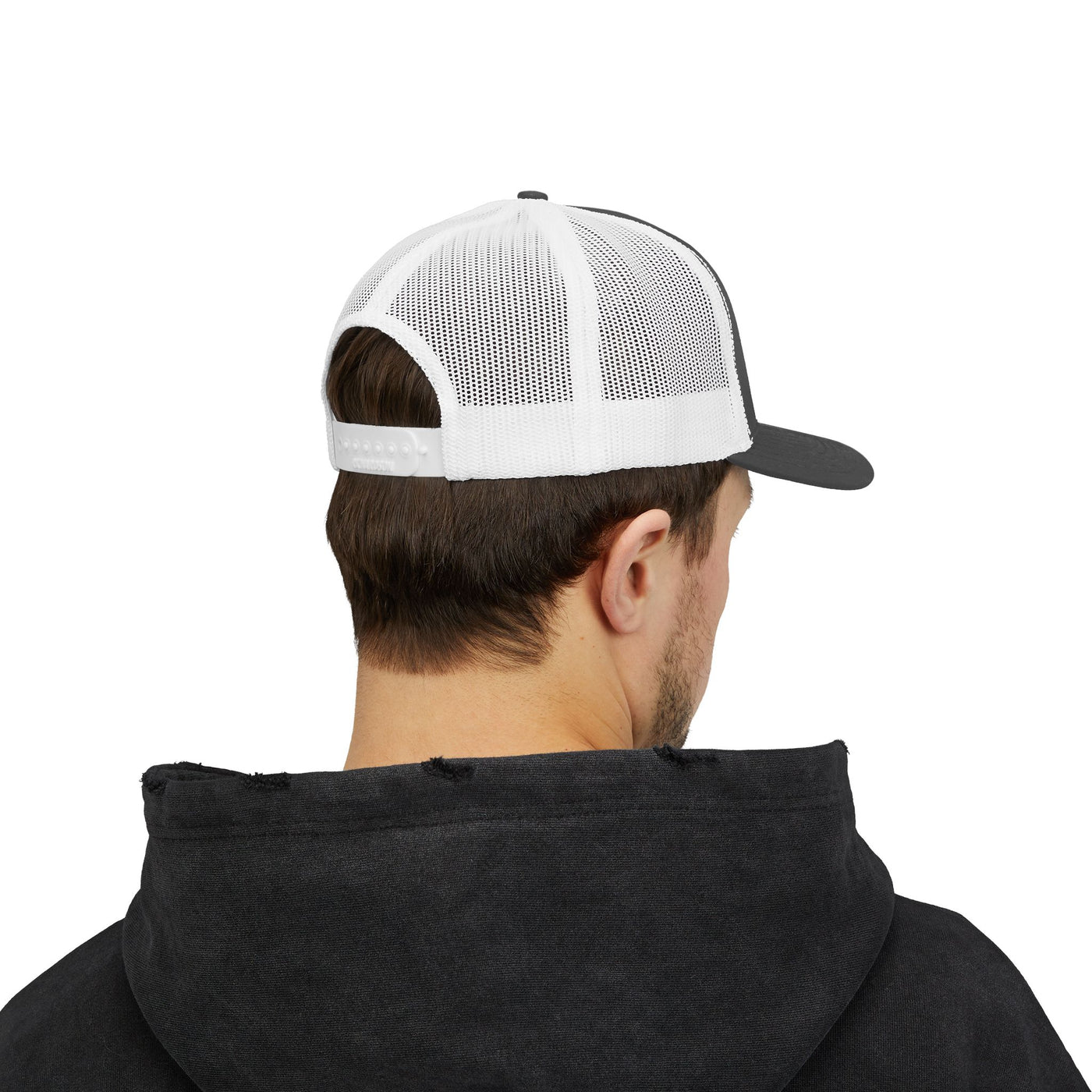 Back view of a man wearing a Trucker Snapback Cap with a white mesh panel and a black brim.