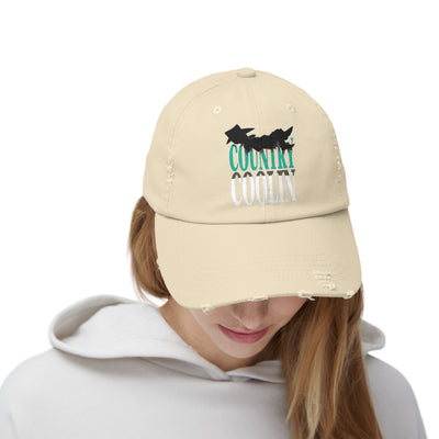 Unisex distressed cap in beige with 'Country Coolin' lettering, featuring a low profile and adjustable fit.